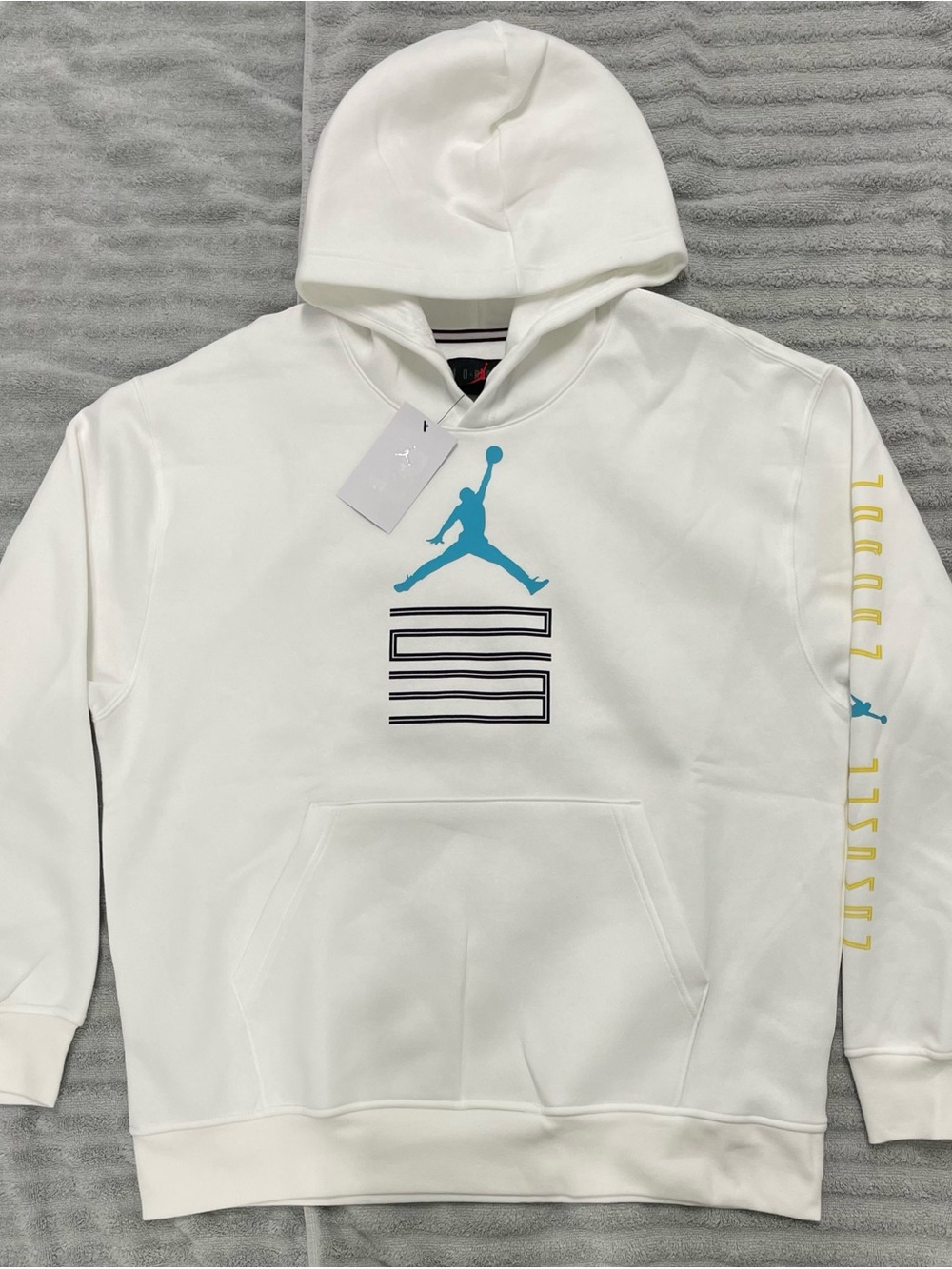 Jordan White Hoodie with Teal Jumpman and Navy Stripe Graphic